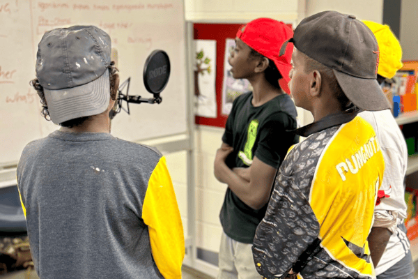 Students recording Keep The Fire Burning