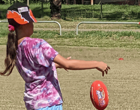 Strong Young Women of Nauiyu Kicking Goals